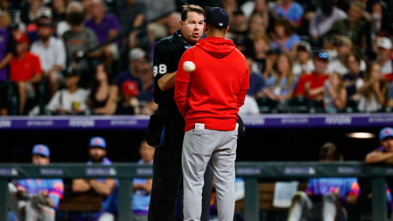 Cards, Rockies tilt caps in protest of ump's edict